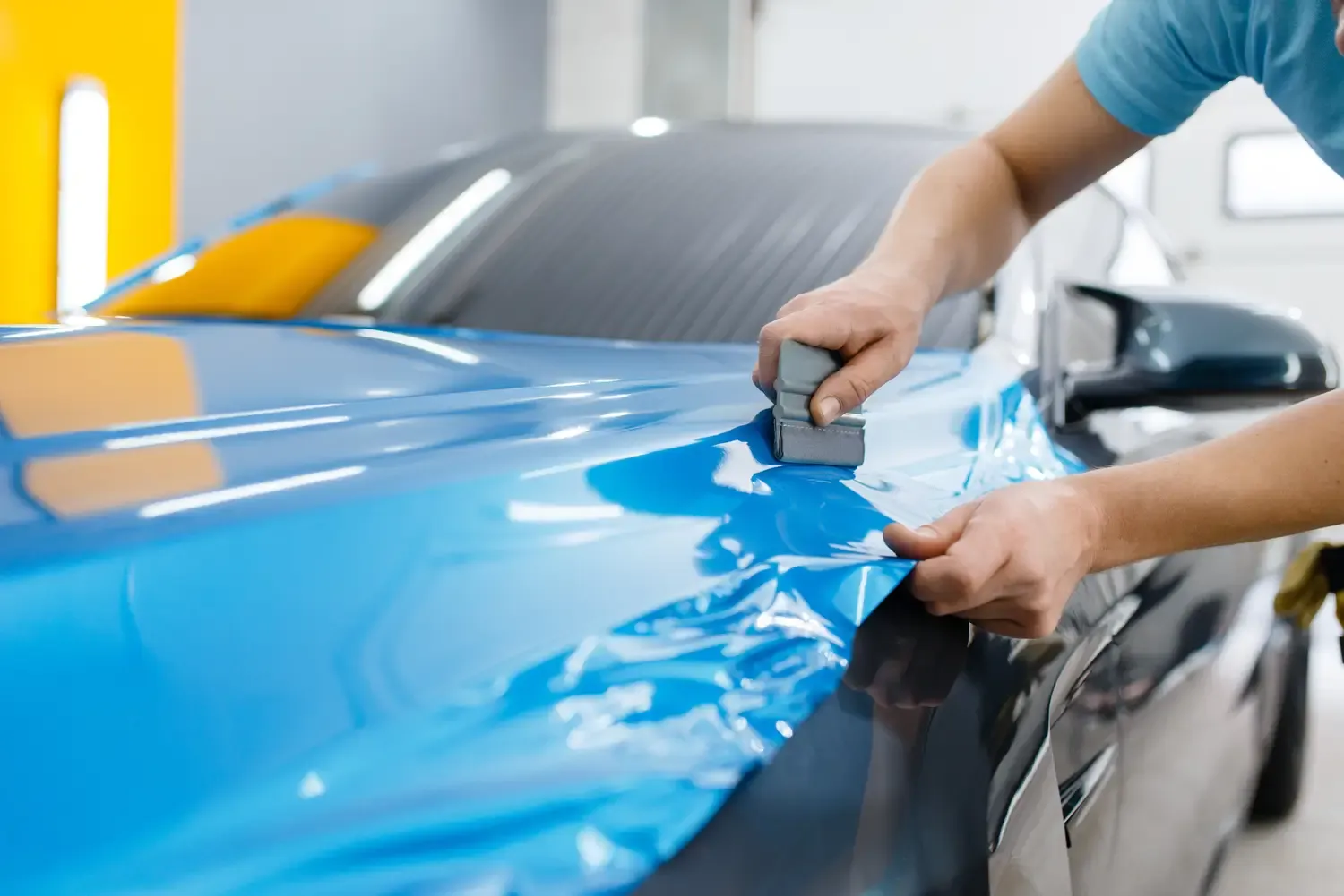 Vehicle wrap installation in progress, color change panel